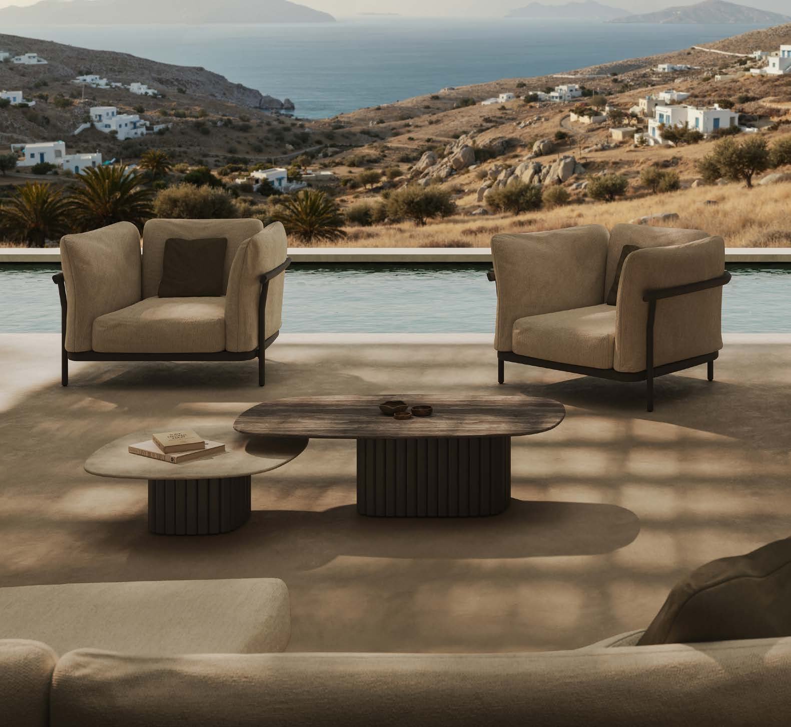 Nami lounge chair and coffee tables overlooking the sea.